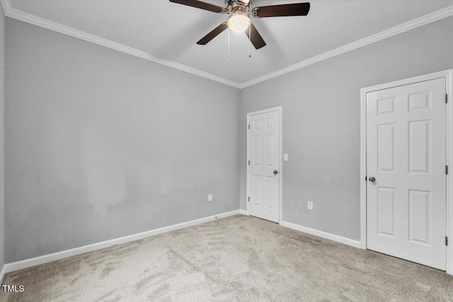 213 Guerrant St, Greensboro, NC 27401 - unfurnished bedroom featuring ornamental molding, carpet floors, and a ceiling fan