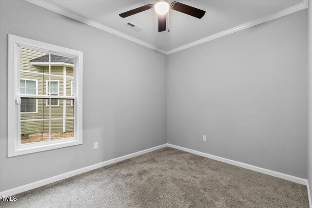 213 Guerrant St, Greensboro, NC 27401 - empty room featuring carpet floors, ornamental molding, and ceiling fan