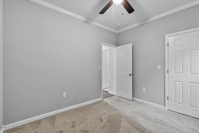 213 Guerrant St, Greensboro, NC 27401 - unfurnished bedroom with ornamental molding, carpet, and ceiling fan