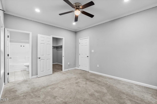 213 Guerrant St, Greensboro, NC 27401 - unfurnished bedroom featuring carpet, recessed lighting, connected bathroom, ornamental molding, and a spacious closet
