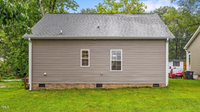 213 Guerrant St, Greensboro, NC 27401 - view of property exterior with crawl space, a yard, and a shingled roof