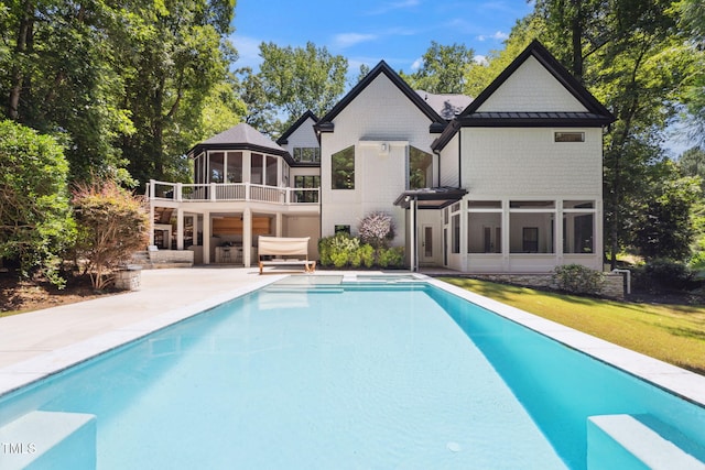 6701 Green Hollow Ct, Wake Forest, NC 27587 - rear view of property with an outdoor pool, a gazebo, a patio area, a standing seam roof, and a lawn