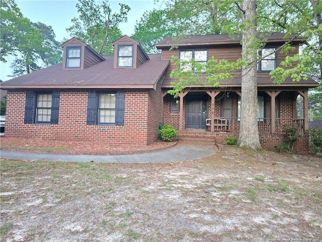 1654 Baysden Ct, Fayetteville, NC 28303 - view of front facade with a porch and brick siding