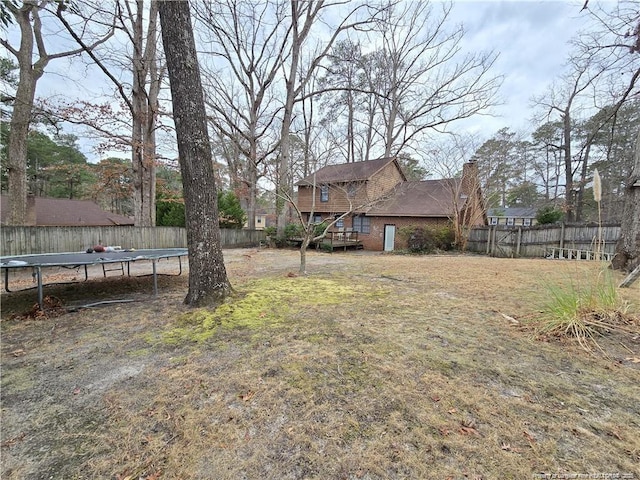 1654 Baysden Ct, Fayetteville, NC 28303 - fenced backyard with a trampoline