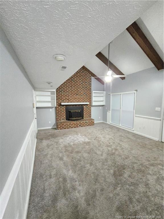 1654 Baysden Ct, Fayetteville, NC 28303 - unfurnished living room featuring carpet floors, a brick fireplace, a textured ceiling, and a ceiling fan