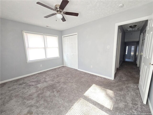 1654 Baysden Ct, Fayetteville, NC 28303 - unfurnished bedroom with carpet floors, a closet, ceiling fan, and a textured ceiling