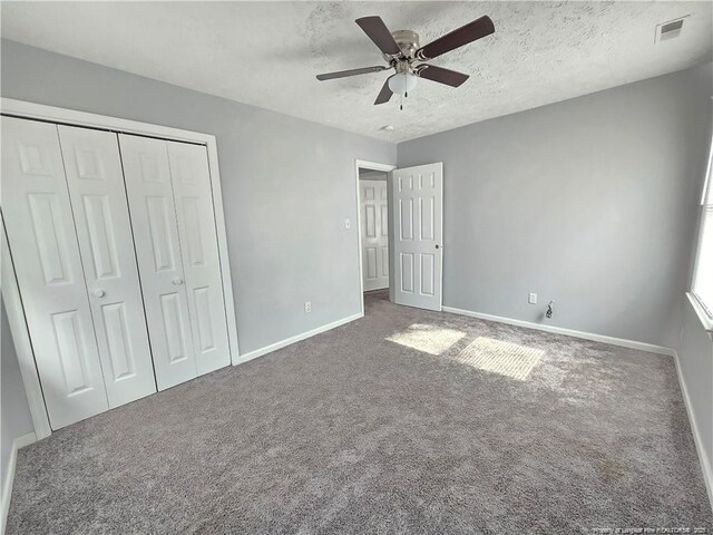 1654 Baysden Ct, Fayetteville, NC 28303 - unfurnished bedroom with carpet, a closet, a textured ceiling, and a ceiling fan