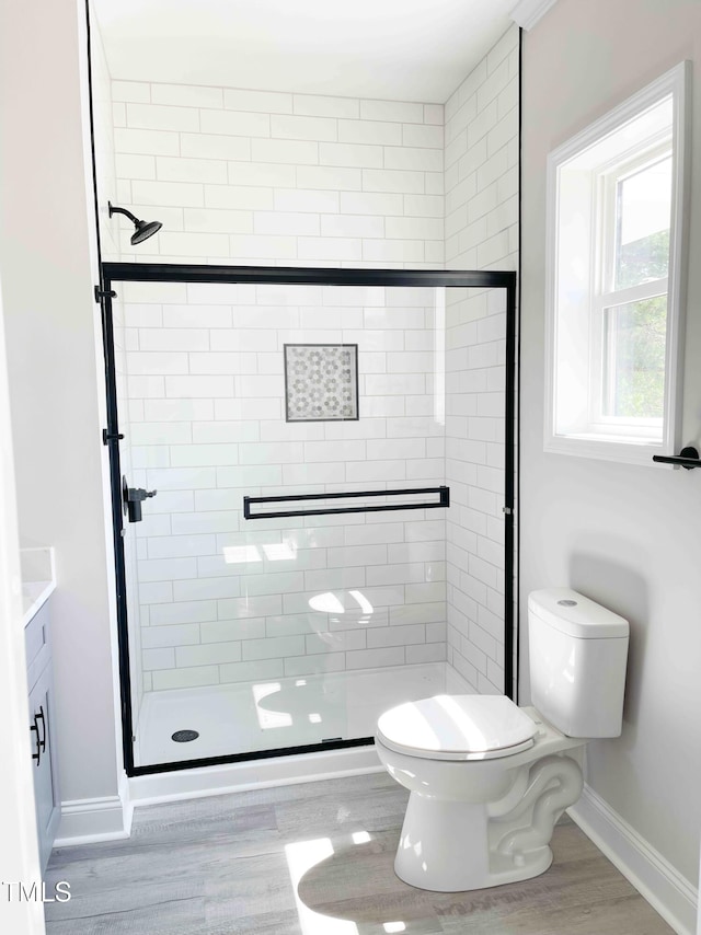 341 Rev Henderson Rd, Henderson, NC 27537 - bathroom featuring a shower stall, wood finished floors, and vanity