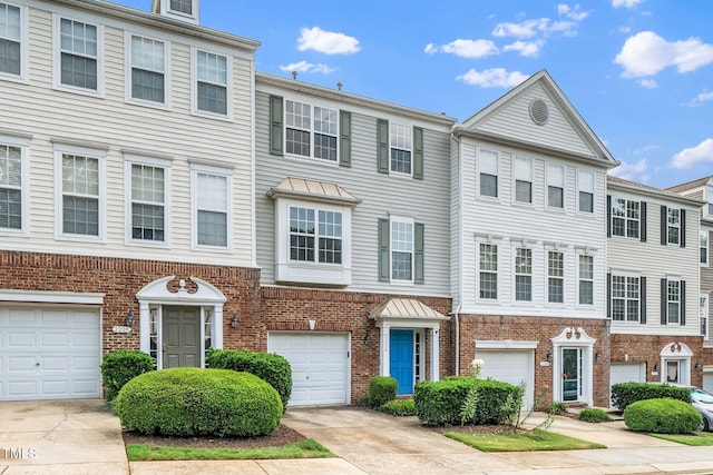 7226 Corvette Ct, Raleigh, NC 27613 - colonial house featuring brick siding, driveway, and a garage
