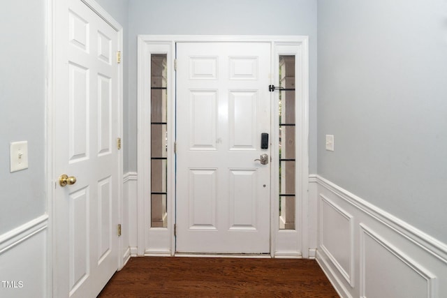 7226 Corvette Ct, Raleigh, NC 27613 - doorway with a wainscoted wall, a decorative wall, and dark wood finished floors