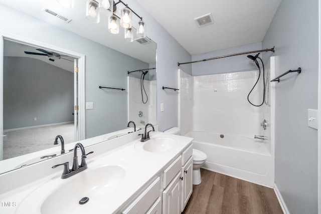 7226 Corvette Ct, Raleigh, NC 27613 - bathroom with shower / bath combination, double vanity, and wood finished floors