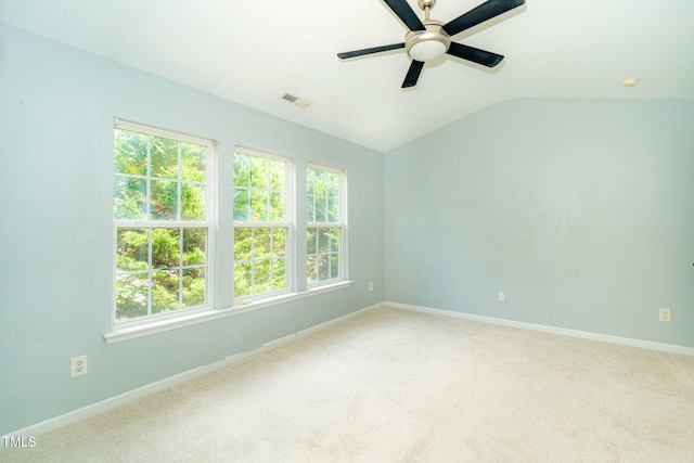 7226 Corvette Ct, Raleigh, NC 27613 - empty room featuring a ceiling fan, vaulted ceiling, light colored carpet, and a smoke detector
