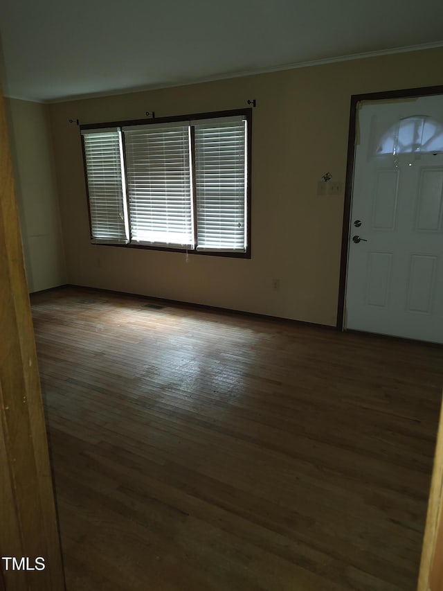 1161 Morgan Rd, Henderson, NC 27537 - spare room featuring crown molding and wood finished floors