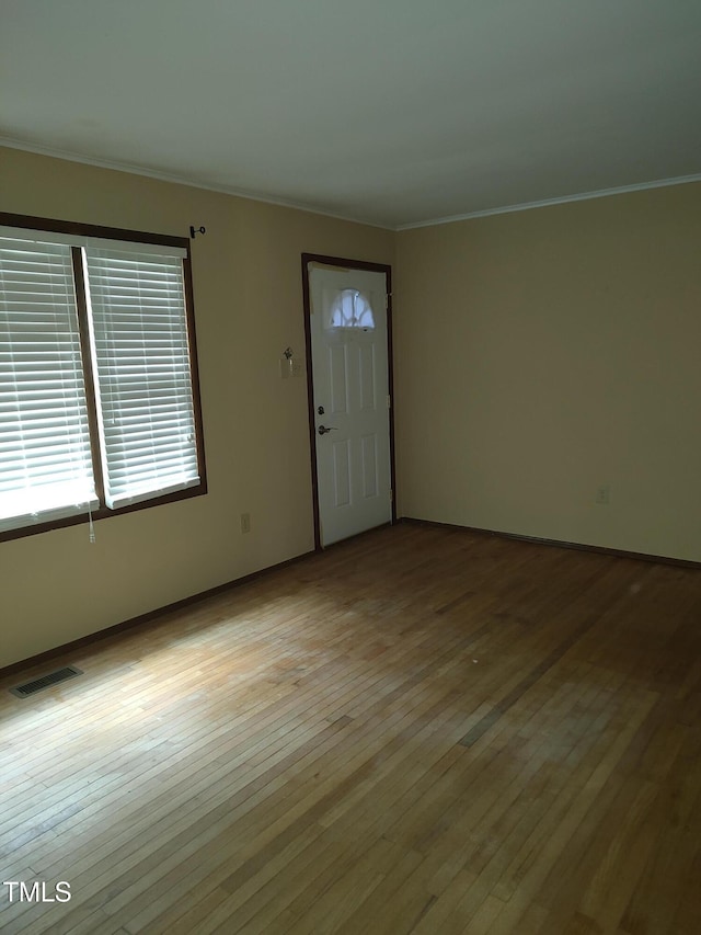 1161 Morgan Rd, Henderson, NC 27537 - entryway with ornamental molding and light wood-style flooring
