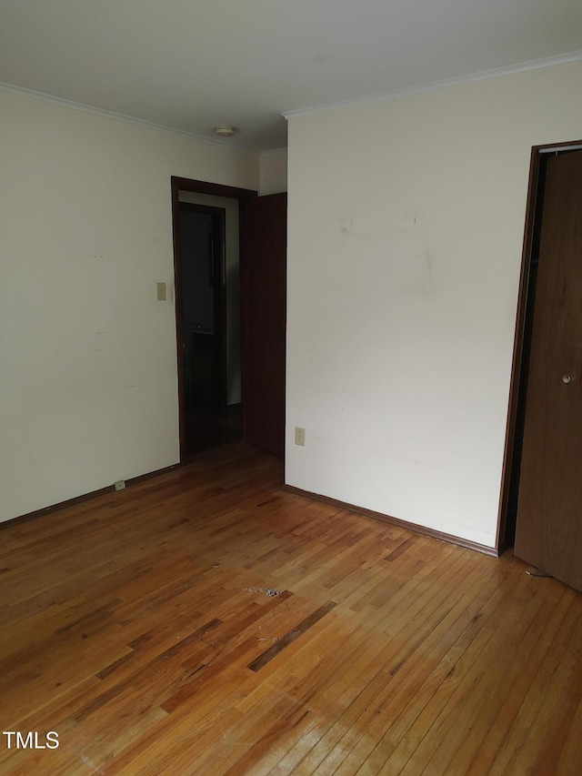 1161 Morgan Rd, Henderson, NC 27537 - empty room featuring light wood-style flooring and ornamental molding