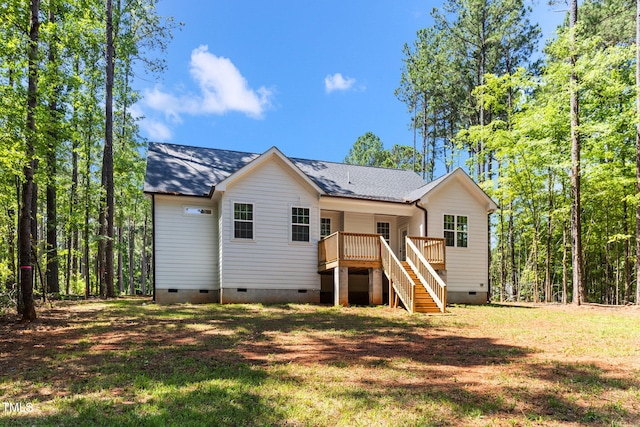 121 Quarterhorse Dr, Louisburg, NC 27549 - back of property featuring crawl space, stairs, a wooden deck, and a lawn