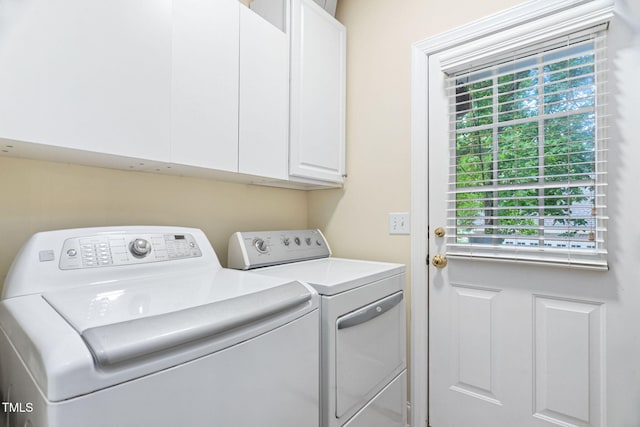 2608 Forestbluff Dr, Fuquay Varina, NC 27526 - washroom featuring washing machine and dryer, cabinet space, and healthy amount of natural light