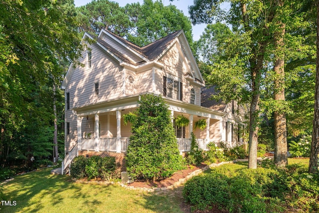 2608 Forestbluff Dr, Fuquay Varina, NC 27526 - view of side of property featuring a porch and a lawn