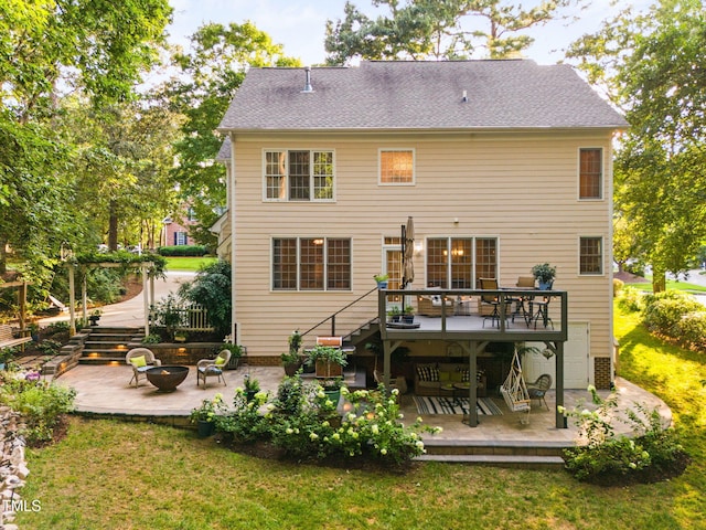 2608 Forestbluff Dr, Fuquay Varina, NC 27526 - back of house featuring a fire pit, a deck, a patio, stairs, and a lawn