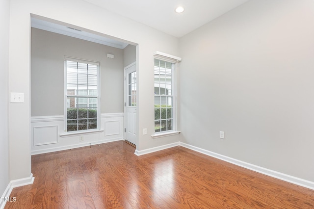 732 Hornchurch Loop, Cary, NC 27519 - spare room with wood finished floors, recessed lighting, and wainscoting