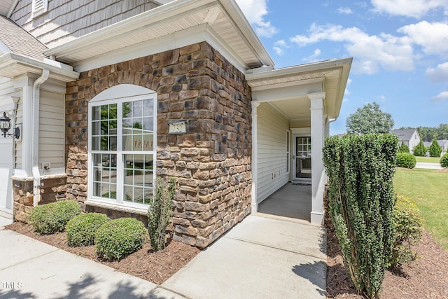 732 Hornchurch Loop, Cary, NC 27519 - doorway to property with stone siding and covered porch