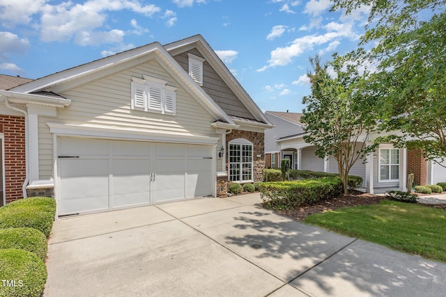 732 Hornchurch Loop, Cary, NC 27519 - view of front facade with stone siding and driveway