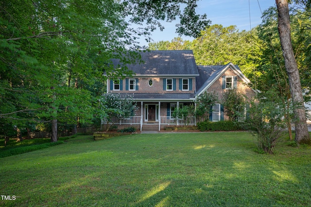 900 Stonecutter Ct, Raleigh, NC 27614 - back of house with covered porch, a yard, and brick siding