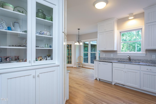 900 Stonecutter Ct, Raleigh, NC 27614 - kitchen with dishwasher, light wood-style flooring, light stone countertops, and white cabinets
