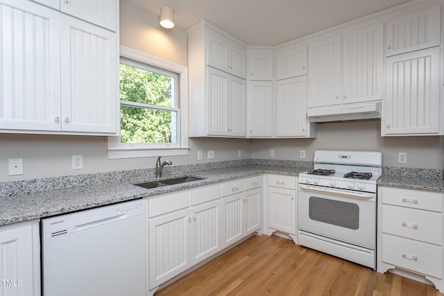 900 Stonecutter Ct, Raleigh, NC 27614 - kitchen with white appliances, under cabinet range hood, white cabinets, light wood-style floors, and light stone counters