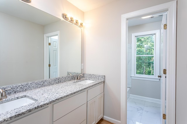 900 Stonecutter Ct, Raleigh, NC 27614 - bathroom with double vanity, marble finish floors, and a bath