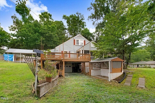 607 E Geer St, Durham, NC 27701 - back of property with a wooden deck, a yard, and an attached garage