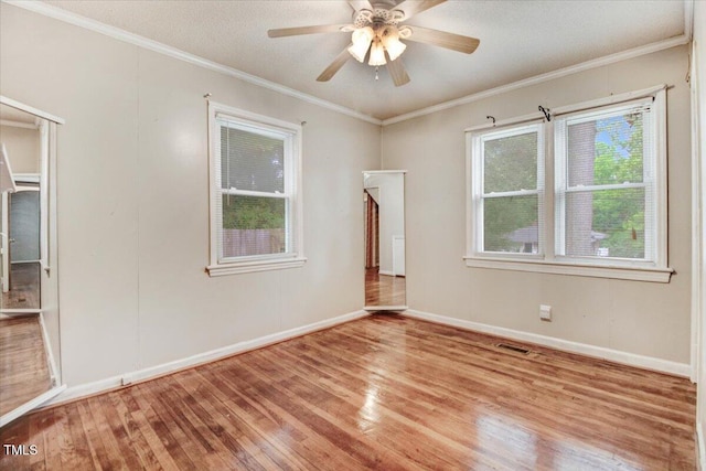 607 E Geer St, Durham, NC 27701 - unfurnished room with wood finished floors, ornamental molding, and a ceiling fan