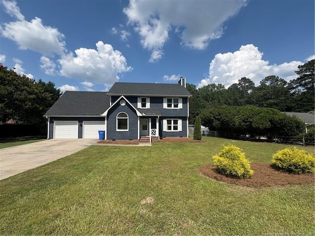 1673 Sykes Pond Rd, Fayetteville, NC 28304 - colonial-style house with concrete driveway, a chimney, and an attached garage