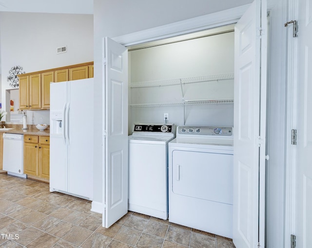 325 Millet Dr, Morrisville, NC 27560 - laundry area featuring washer and clothes dryer and stone finish flooring