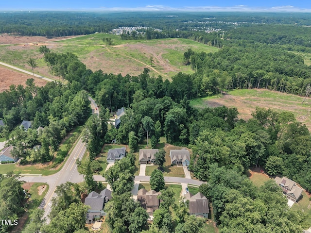 211 Camille Cir, Youngsville, NC 27596 - aerial view of property and surrounding area featuring a forest and nearby suburban area