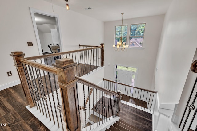 211 Camille Cir, Youngsville, NC 27596 - stairs featuring a chandelier and wood finished floors