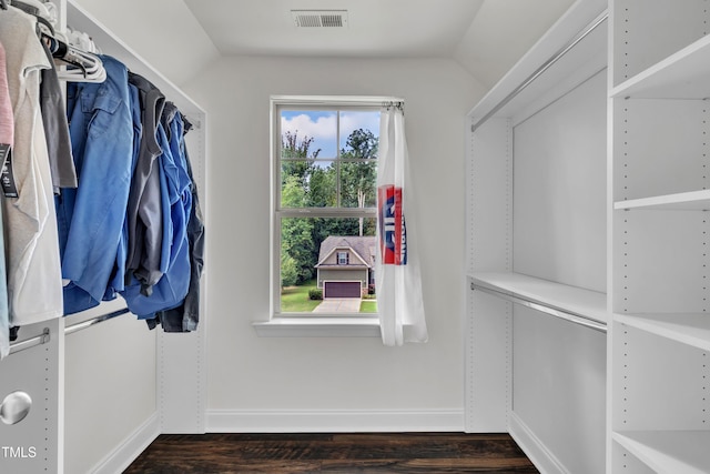 211 Camille Cir, Youngsville, NC 27596 - walk in closet with lofted ceiling and dark wood-type flooring