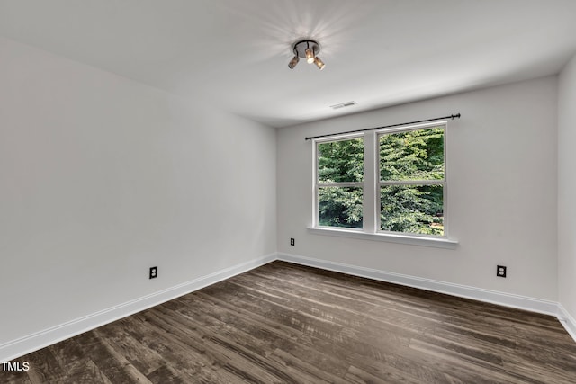 211 Camille Cir, Youngsville, NC 27596 - empty room with baseboards and dark wood-style flooring