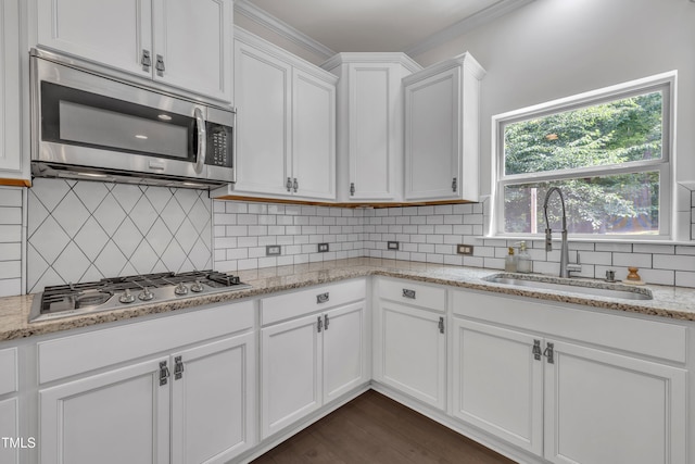 211 Camille Cir, Youngsville, NC 27596 - kitchen featuring stainless steel appliances, white cabinetry, backsplash, light stone counters, and dark wood-style floors
