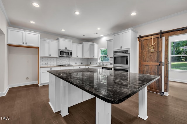 211 Camille Cir, Youngsville, NC 27596 - kitchen with appliances with stainless steel finishes, white cabinetry, ornamental molding, backsplash, and recessed lighting