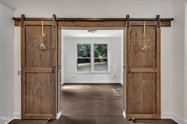 211 Camille Cir, Youngsville, NC 27596 - corridor featuring a barn door and dark wood-style floors