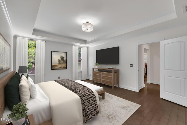 211 Camille Cir, Youngsville, NC 27596 - bedroom featuring a raised ceiling, dark wood-style floors, and crown molding