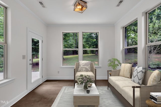 211 Camille Cir, Youngsville, NC 27596 - sunroom / solarium with plenty of natural light, ornamental molding, and wood finished floors