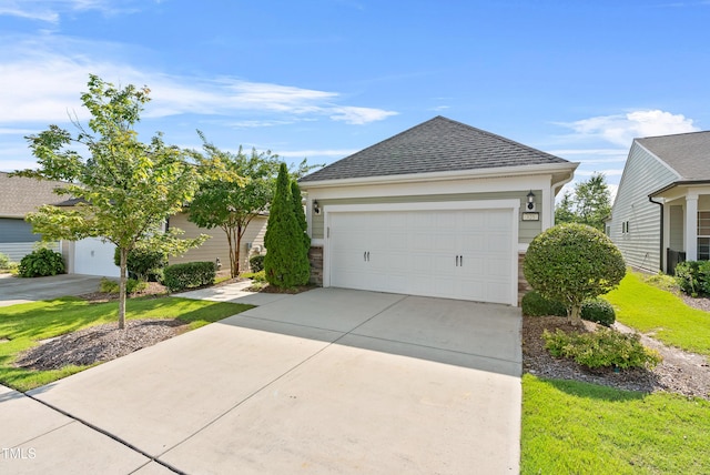 325 Currituck Ln, Durham, NC 27703 - view of front of property with a garage, a shingled roof, and concrete driveway