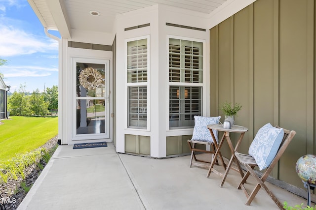 325 Currituck Ln, Durham, NC 27703 - doorway to property featuring board and batten siding and a lawn
