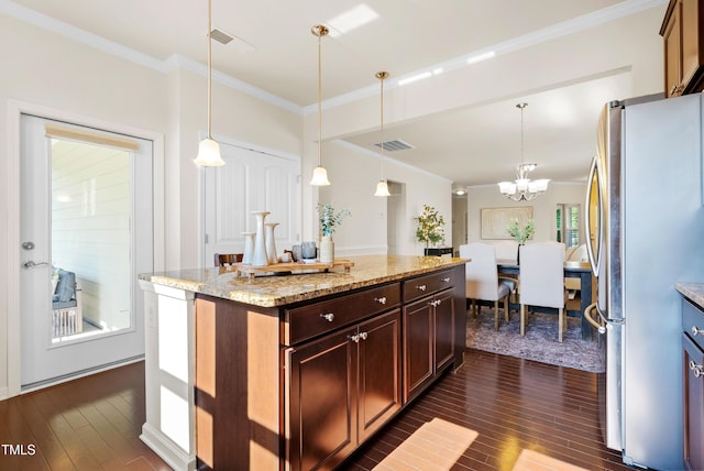 325 Currituck Ln, Durham, NC 27703 - kitchen featuring freestanding refrigerator, dark wood-type flooring, crown molding, a chandelier, and hanging light fixtures