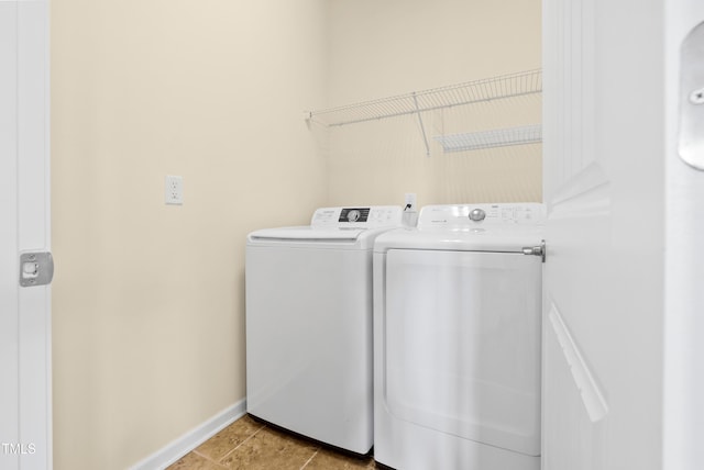 325 Currituck Ln, Durham, NC 27703 - laundry area with washing machine and dryer and light tile patterned floors