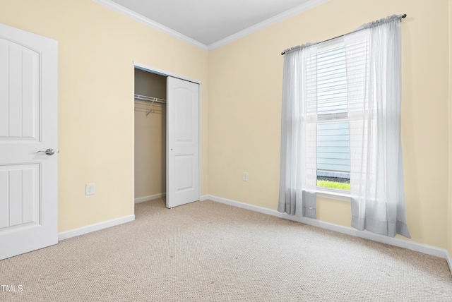 325 Currituck Ln, Durham, NC 27703 - unfurnished bedroom featuring carpet floors, crown molding, and a closet
