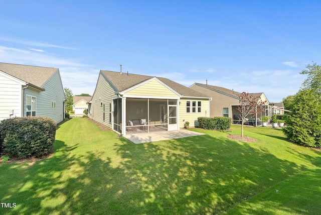 325 Currituck Ln, Durham, NC 27703 - rear view of property with a sunroom and a lawn