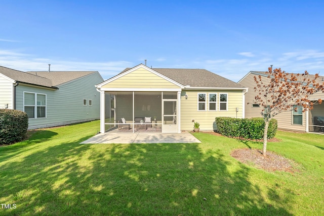 325 Currituck Ln, Durham, NC 27703 - rear view of property featuring a sunroom, a patio area, a lawn, and roof with shingles